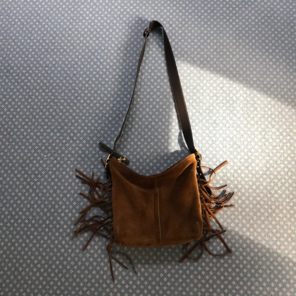 Super cute Coach bag with fringe Fall is around th